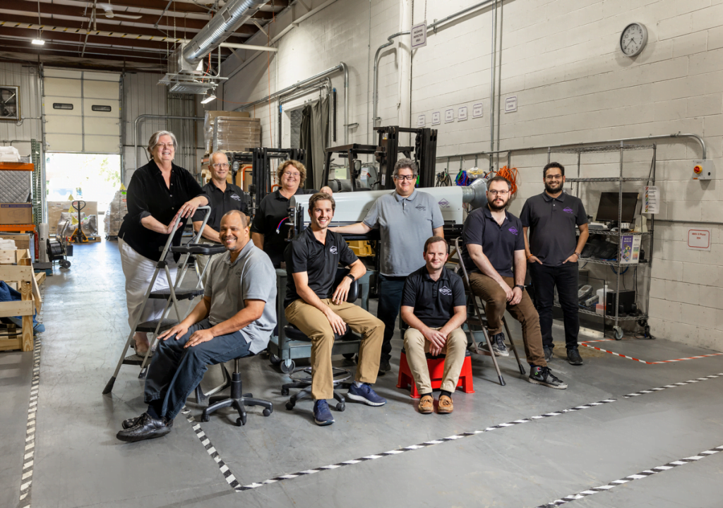 Team photo of Miltec administrative and sales staff in our Maryland warehouse.